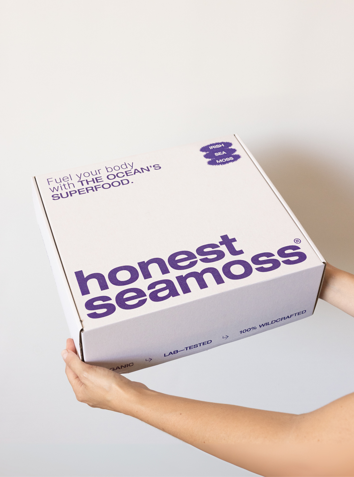 Woman holding the Honest Sea Moss gift box